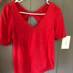 Red/coral shirt sleeve shirt.